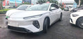 White BYD sedan, front three-quarter exterior view