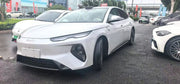 White BYD sedan, front three-quarter exterior view