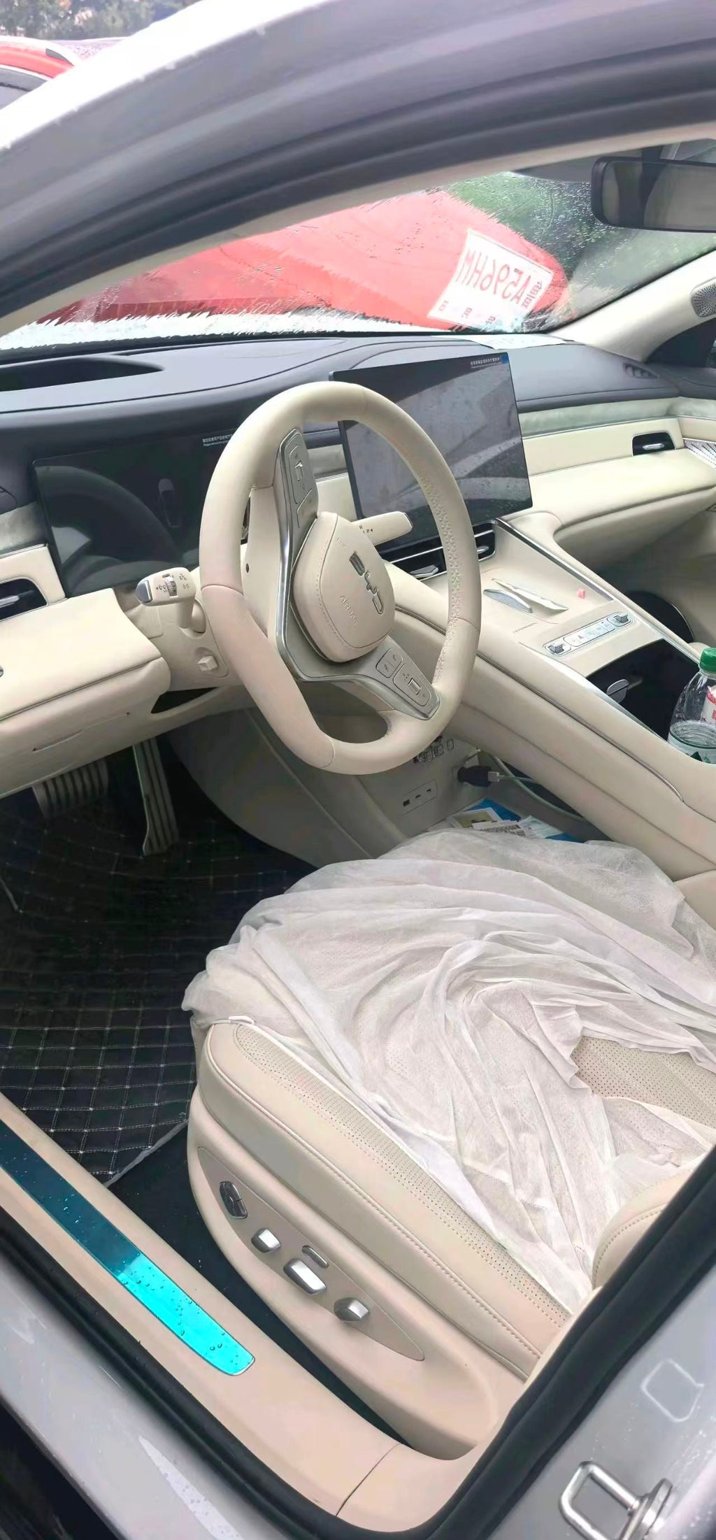 BYD sedan front cabin, steering wheel and central touchscreen