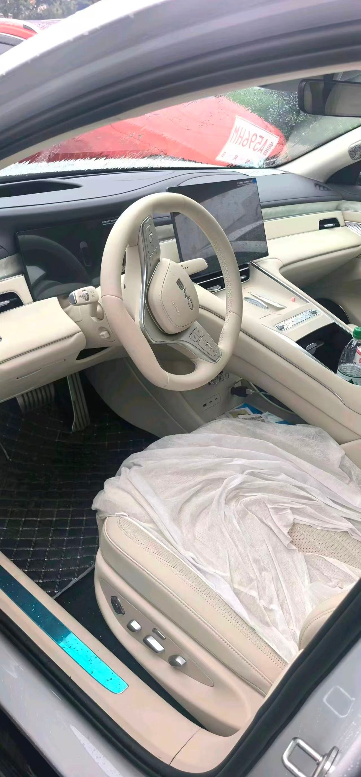 BYD sedan front cabin, steering wheel and central touchscreen